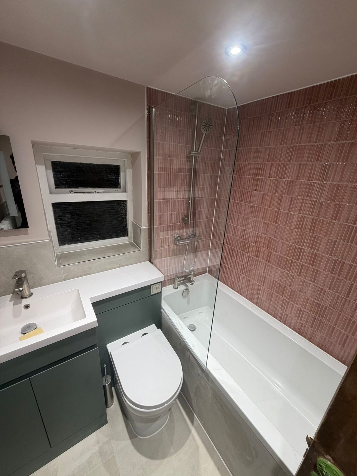Bathroom with grey vanity and bath