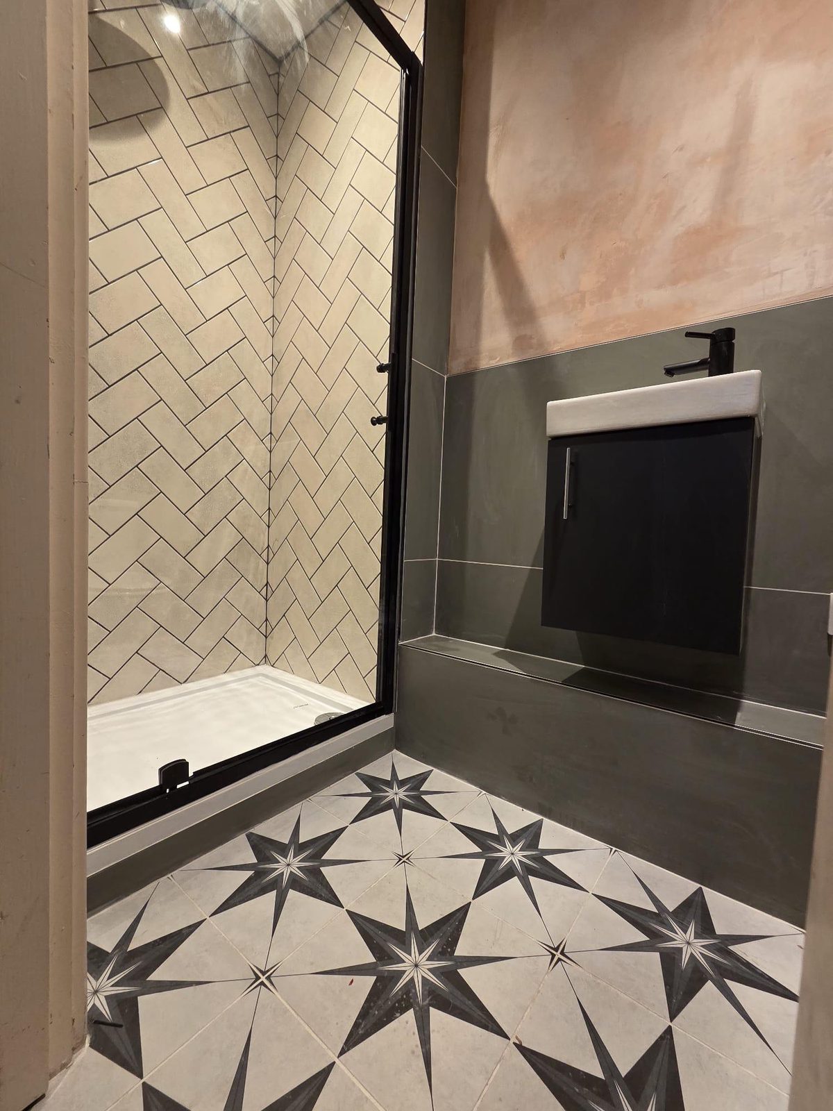 Herringbone shower with star-tile floor