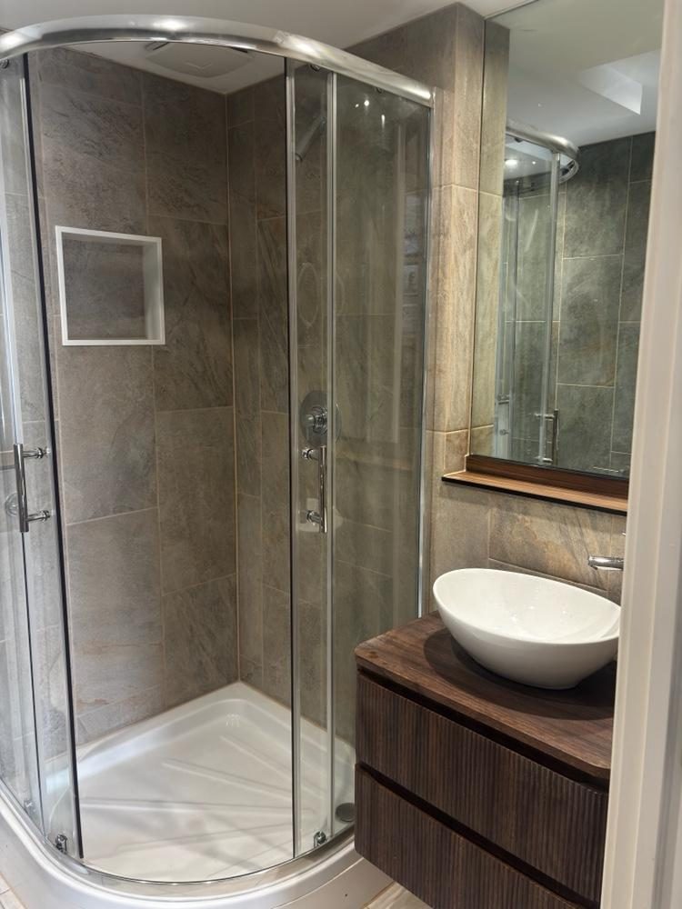 Bespoke bathroom with quadrant shower and walnut vanity